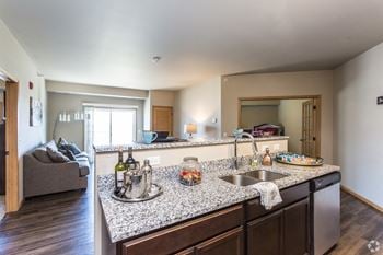 Spacious living areas with open floor plan to the kitchen